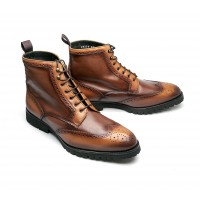 Brogue boot in patinated calfskin with commando sole