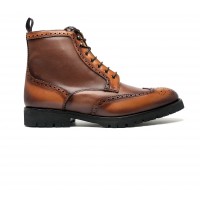 Brogue boot in patinated calfskin with commando sole