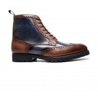 Brogue boot in patinated calfskin with commando sole