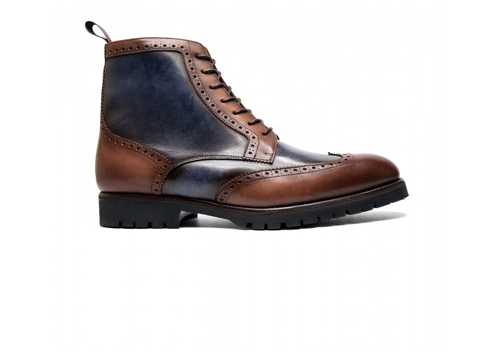 Brogue boot in patinated calfskin with commando sole